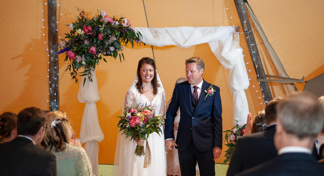 decorated wedding arch wedding flowers by https://floristshopevents.co.uk/